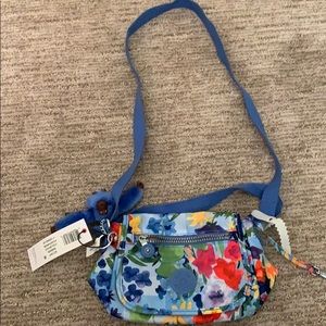 Kipling blue purse. With some tropical flowers!